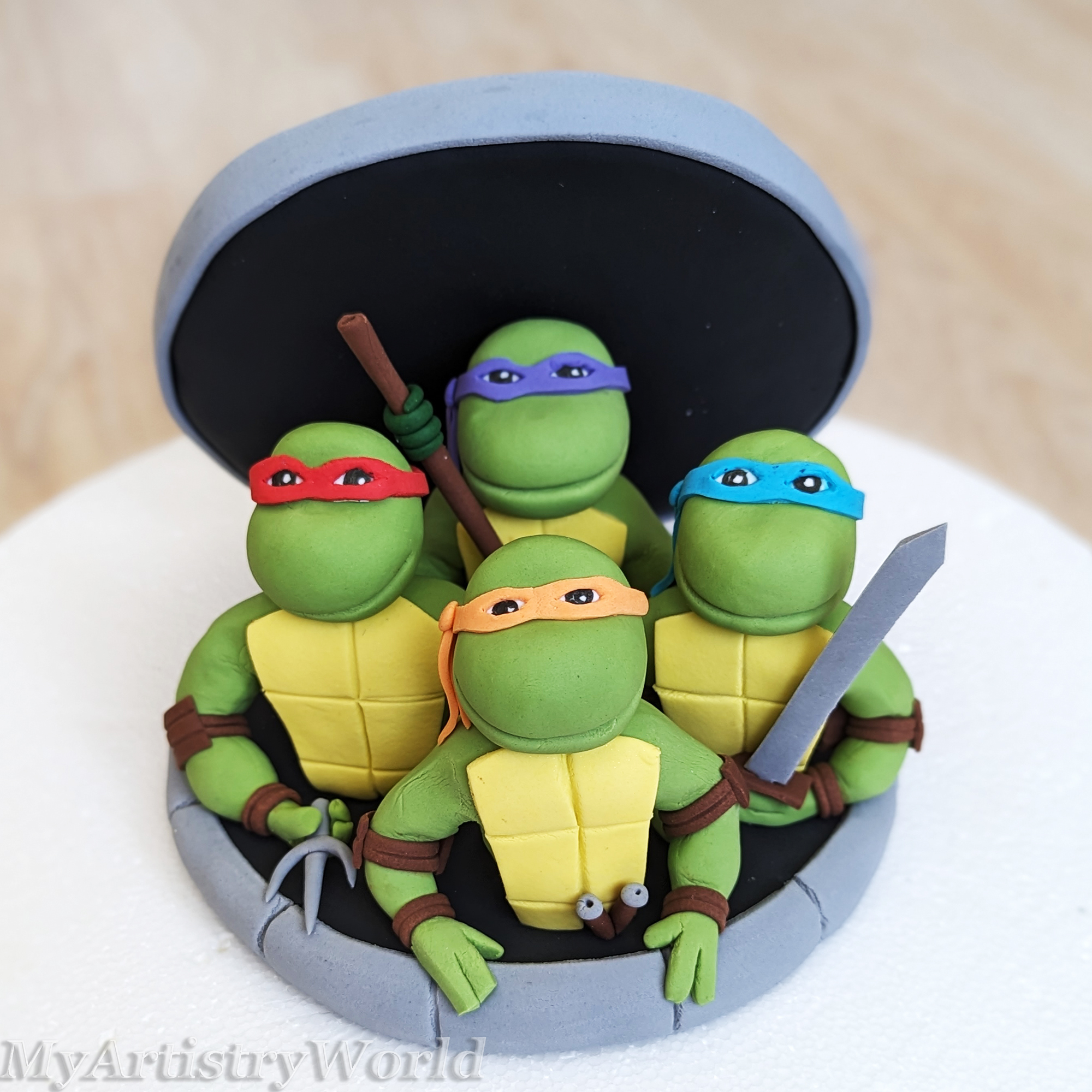 Ninja Turtles coming out of Sewer cake topper
