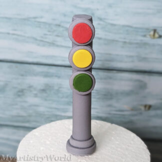 Handmade edible fondant traffic light cake topper with red yellow and green lights