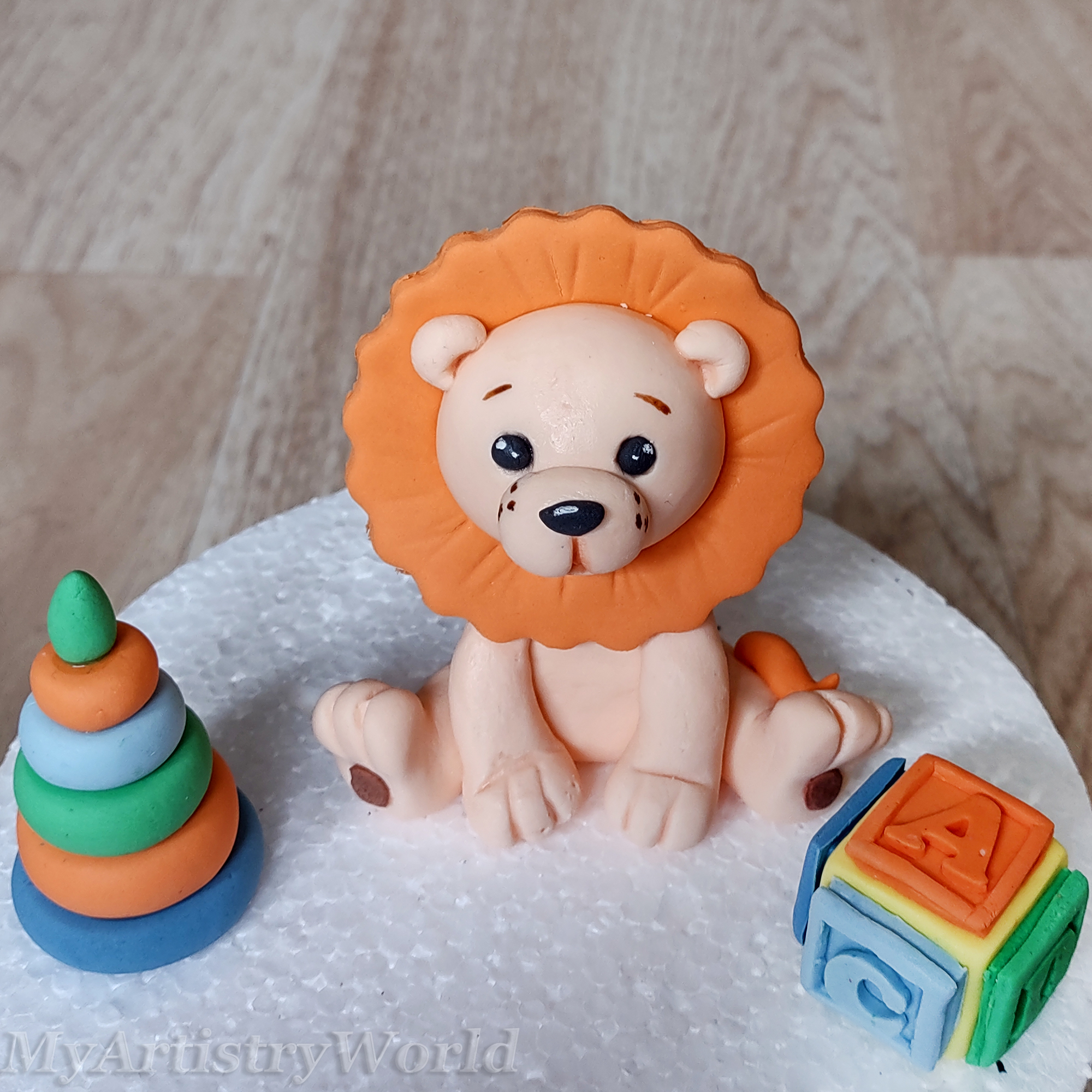 Lion with toys cake topper