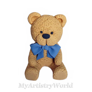 Handmade edible teddy bear cake topper with blue bow for baby shower and birthday cakes