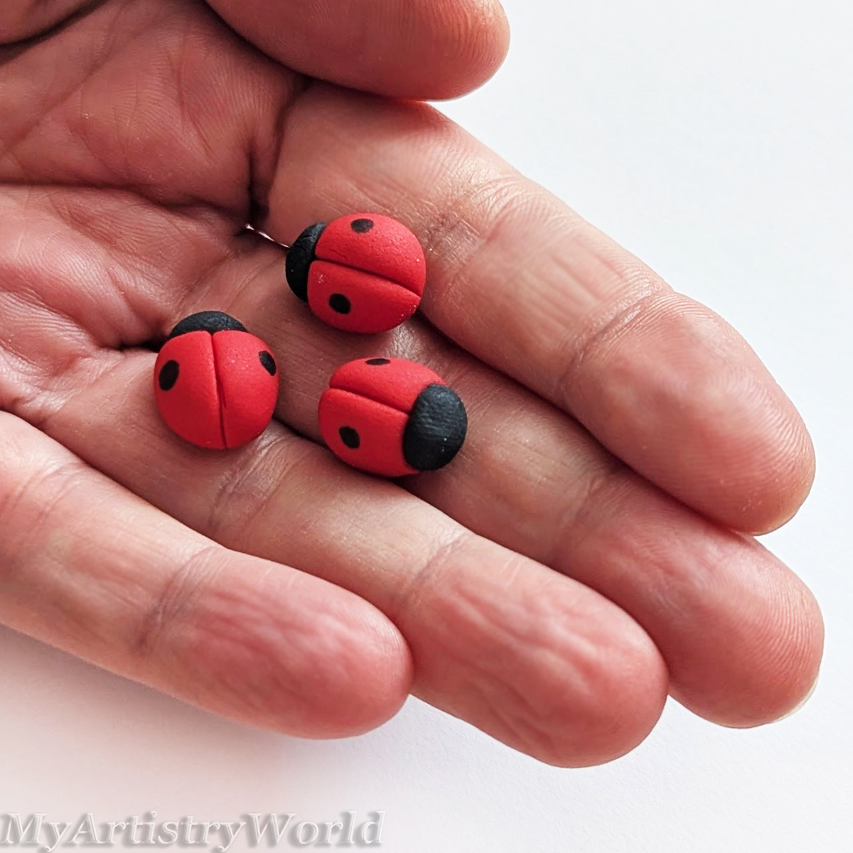 Set of 12 handmade edible fondant ladybugs, approximately 0.5 inch each, for cake and cupcake decorations.