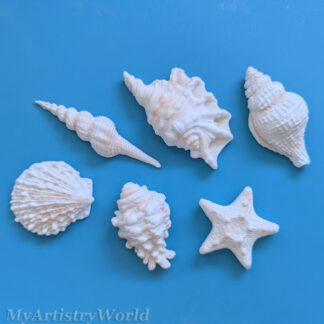 Edible seashell cake toppers with starfish and assorted shell designs