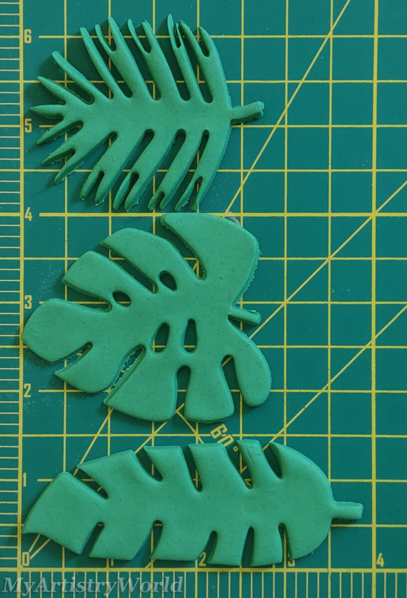 Edible tropical monstera and palm leaf cake toppers for jungle and luau themed cakes and cupcakes.