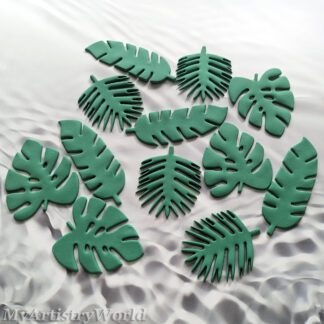 Edible tropical monstera and palm leaf cake toppers for jungle and luau themed cakes and cupcakes.
