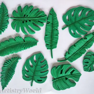 Edible tropical leaf cake toppers — handmade monstera, palm, and banana leaves in green fondant