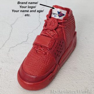 Custom red sneaker cake topper handmade from air-dry clay.