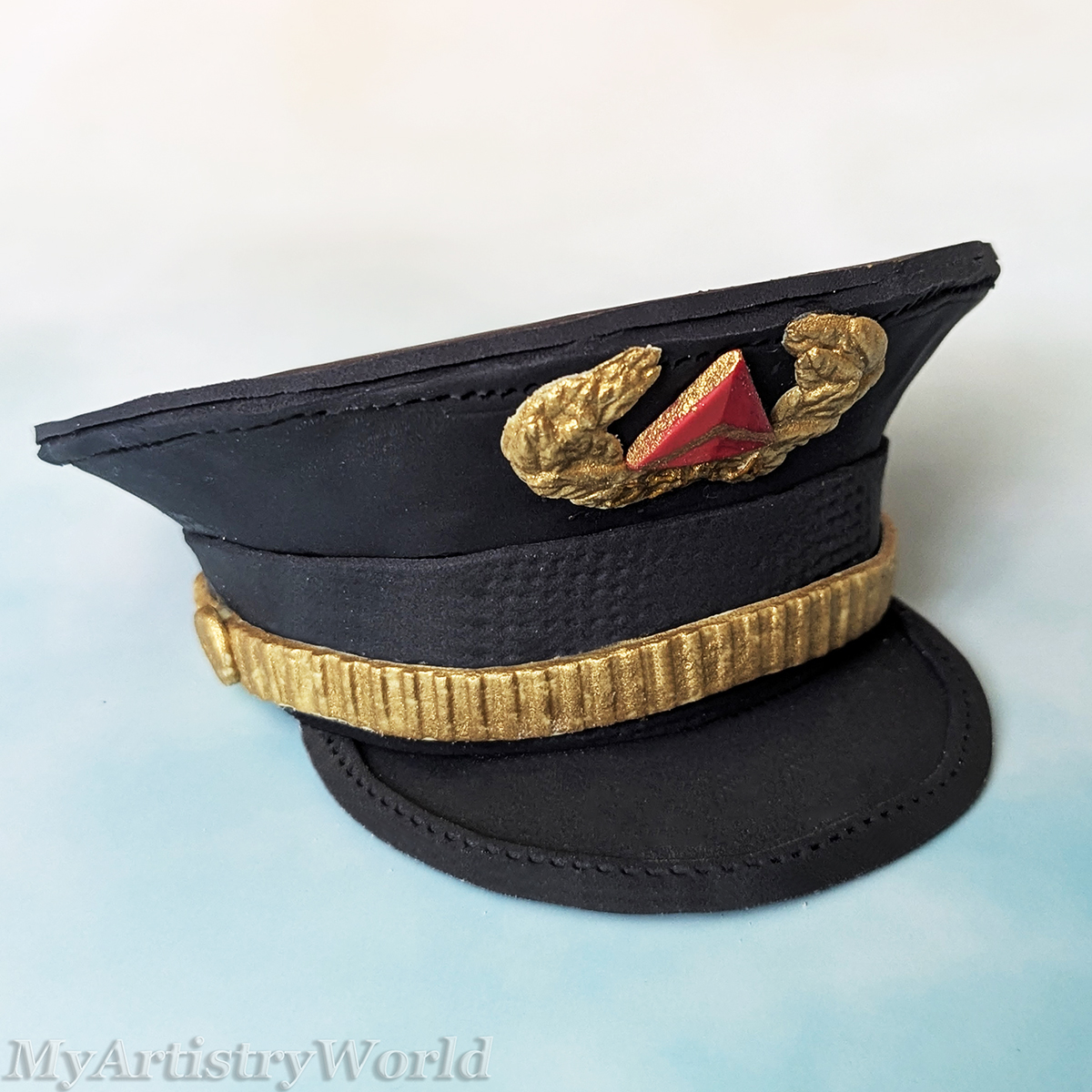 Delta-style airline pilot captain hat cake topper made from edible fondant