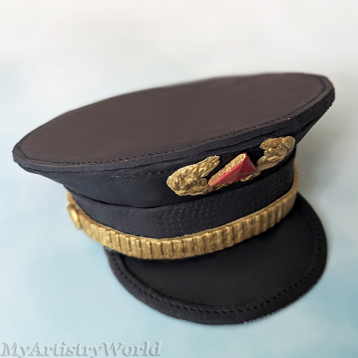 Delta-style airline pilot captain hat cake topper made from edible fondant
