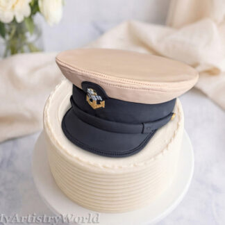 Custom edible Navy captain hat cake topper made from fondant for military retirement, promotion, graduation, and Navy celebration cakes.