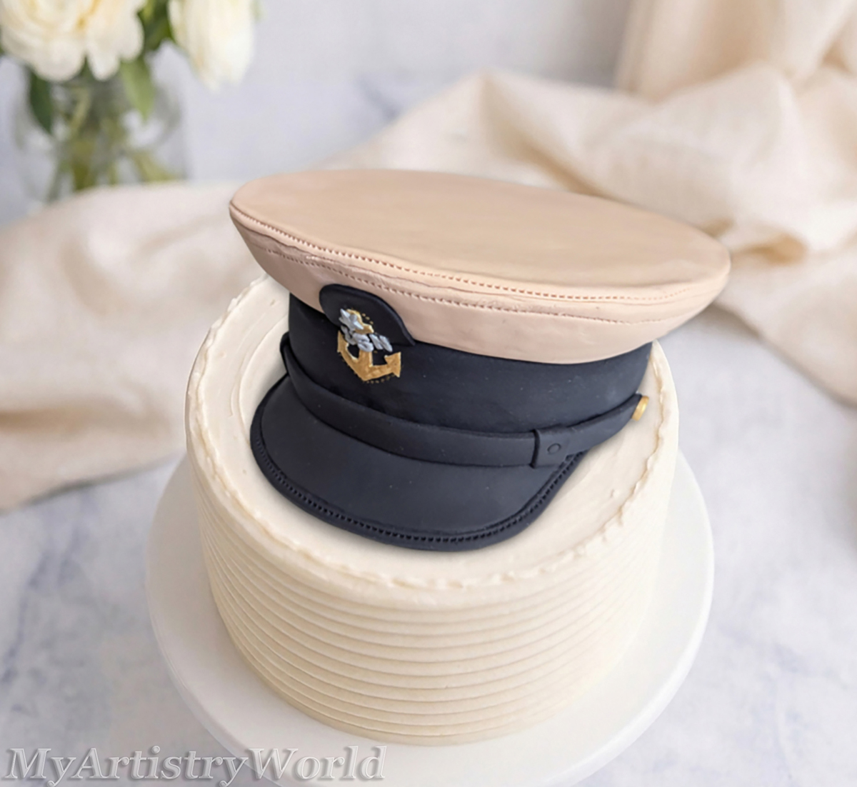 Custom edible Navy captain hat cake topper made from fondant for military retirement, promotion, graduation, and Navy celebration cakes.