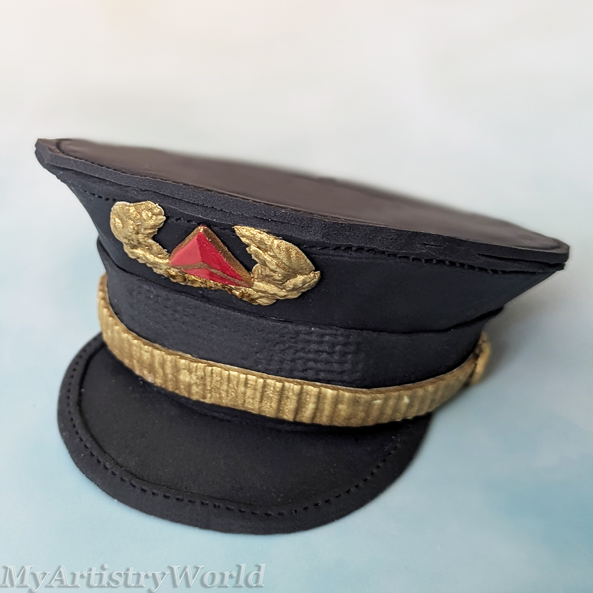 Delta-style airline pilot captain hat cake topper made from edible fondant