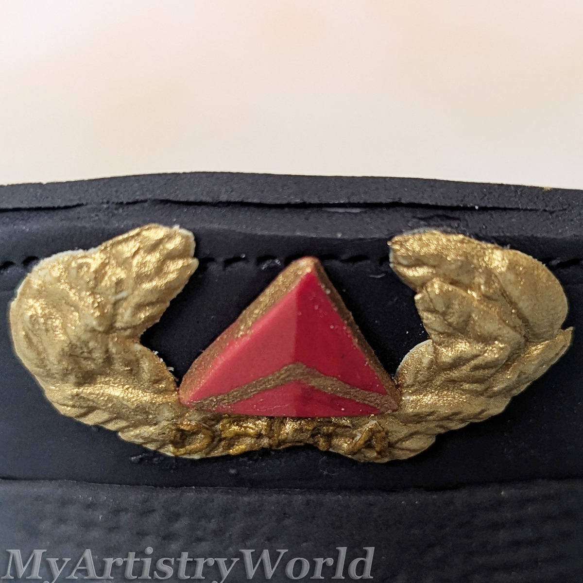 Delta-style airline pilot captain hat cake topper made from edible fondant